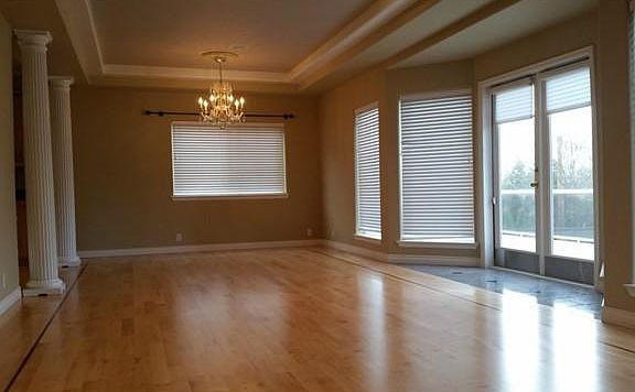 large dinning room with doors to go out on front deck