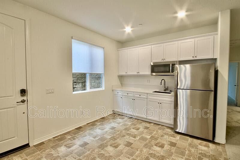 Full size fridge, garbage disposal, and convection oven.