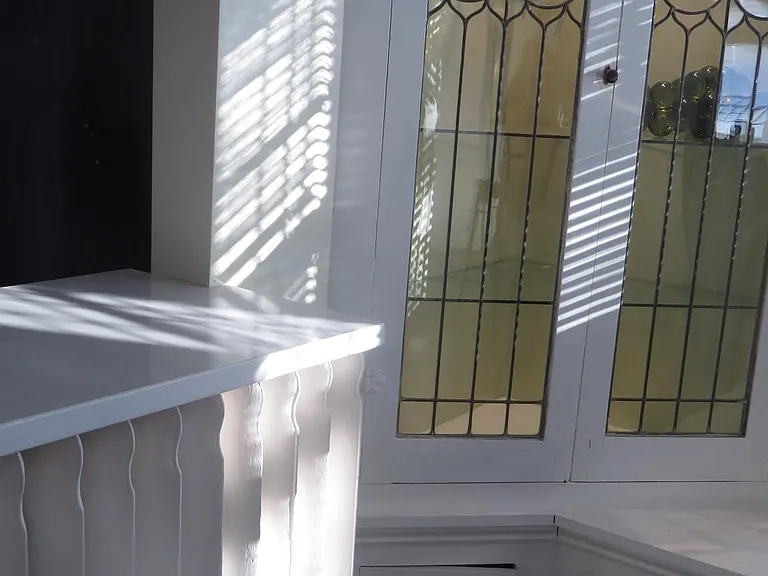 leaded-glass china cabinets w/ glass shelves and dimmer-lights