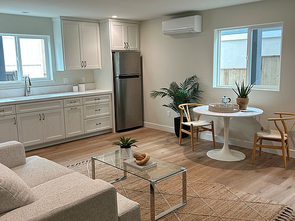 The mini split to the right of the refrigerator provides heat and AC for the entire unit