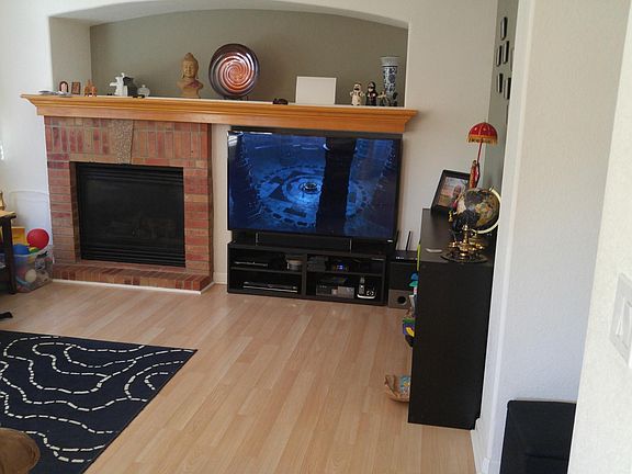 family room with large mantle and fireplace