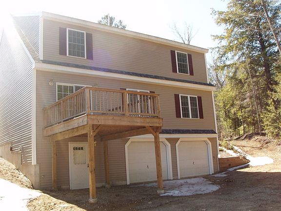 Garage under and deck facing lake