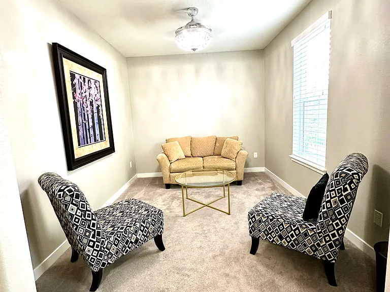 Just off the bedroom is a versatile office or sitting room that offers abundant natural light and a peaceful atmosphere. Whether used as a home office, reading nook, hobby space, or private retreat.