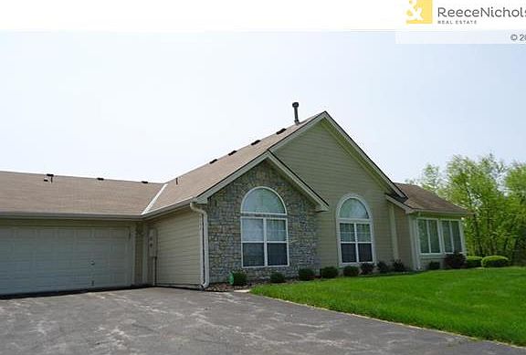 Side view with 2 car attached garage.