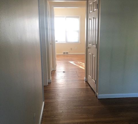 Closet on the right (off living room) and hallway to the bedrooms on the left.