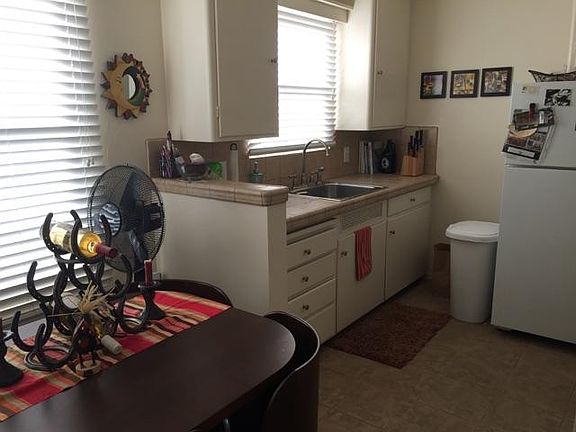 Kitchen with newer counter and floor tile