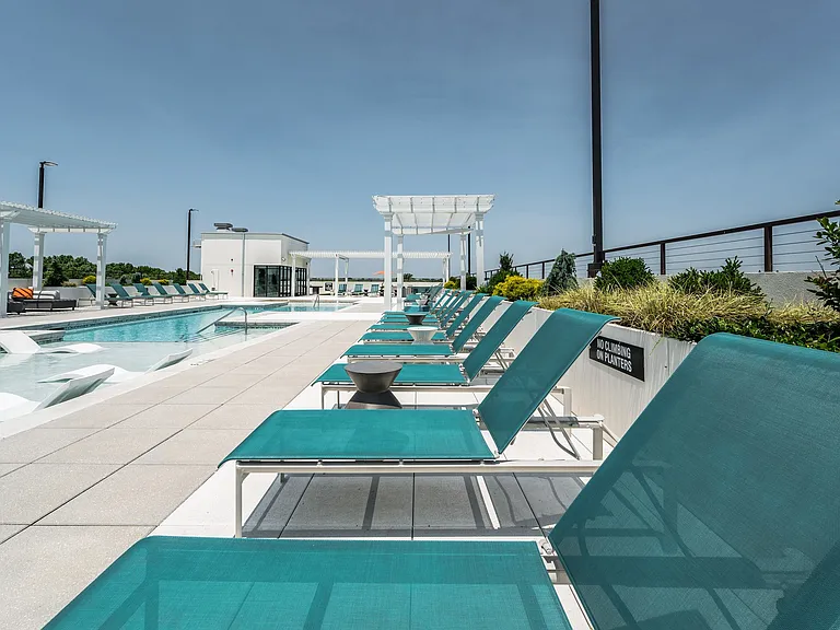 Pool Lounge Chairs on the side of the pool