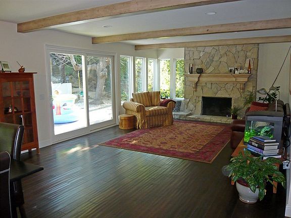 Beam ceilings, stone fireplace in great room