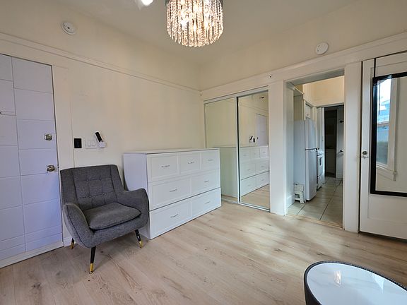 FULLY UPGRADED Studio (furnished: Murphy bed, TV, Sofa, Coffee Table) + private balcony with Ocean view, New flooring, almost new everything, with in-unit laundry!