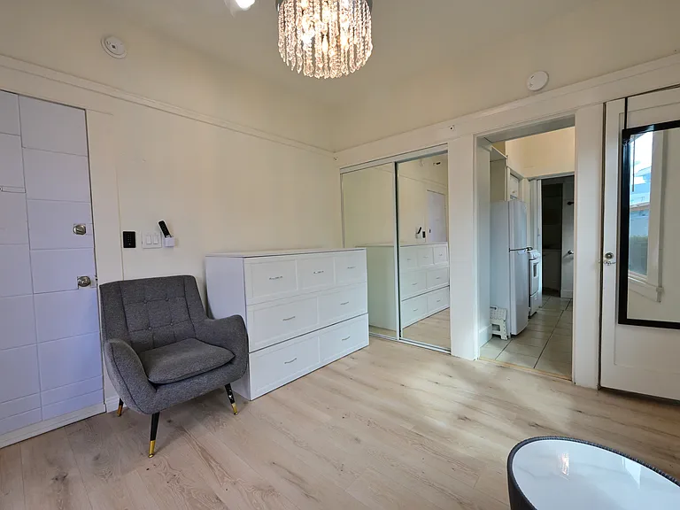 FULLY UPGRADED Studio (furnished: Murphy bed, TV, Sofa, Coffee Table) + private balcony with Ocean view, New flooring, almost new everything, with in-unit laundry!