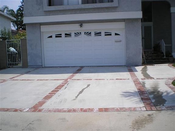 Brick ribbon driveway.