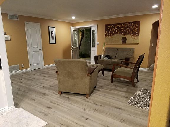 Living room w/ sliding door access to backyard