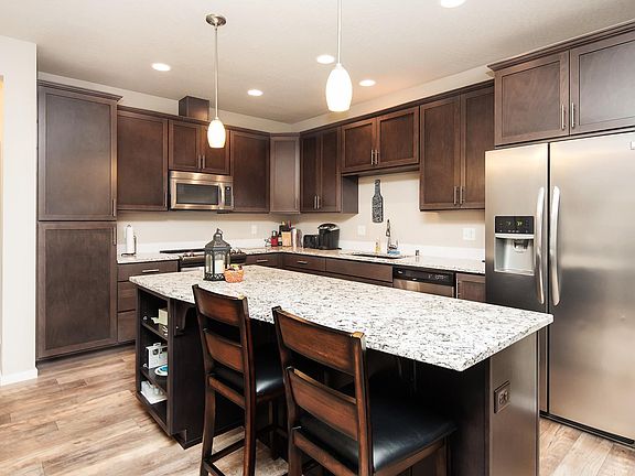 Open Concept Kitchen with granite counters and stainless steel appliances