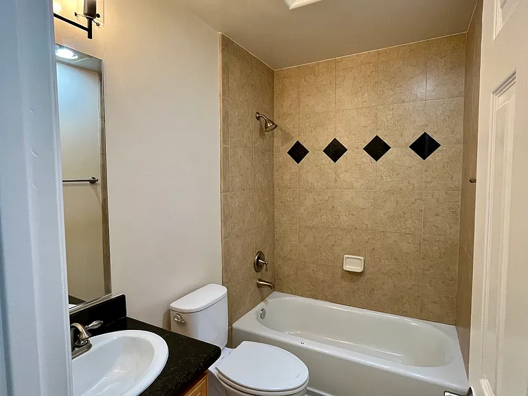 Bright and functional full bath with tub and shower