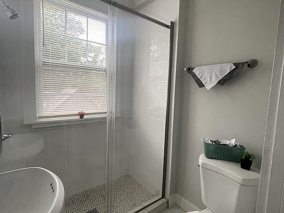 Newly renovated walk in shower with glass doors