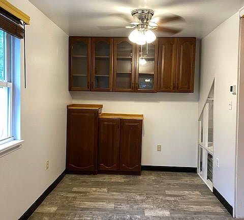 Extra storage under stairs in Dining Room.