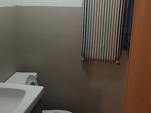 Standing shower, bathroom and bathroom cabinet.