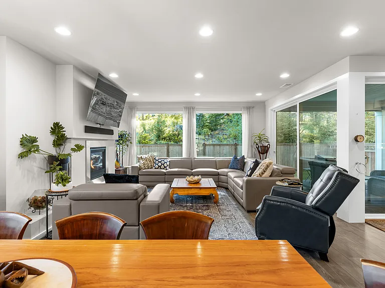 Living room, with gas fireplace, two sets of sliding glass doors for true inside/outside living