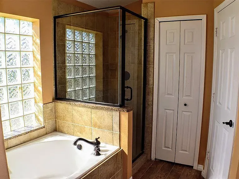 Master bathroom with upgraded bathtab and shower combo