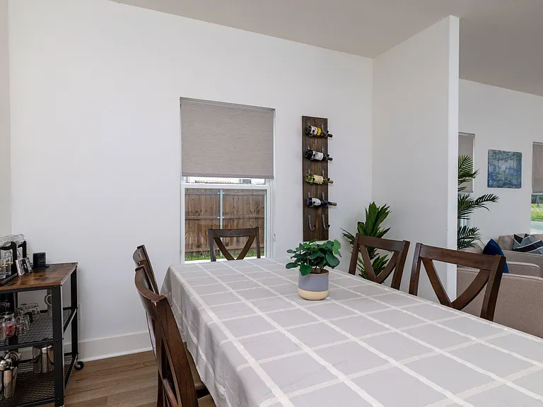 Spend time with friends and family in the dining area seating 6. Also, enjoy the bar set for entertaining.