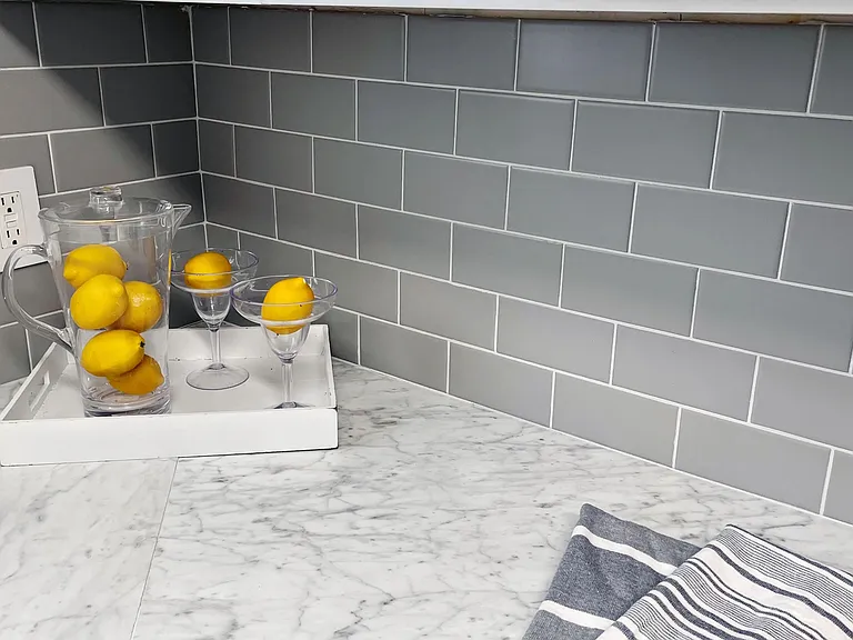 Elevate your culinary haven with our signature touch every kitchen adorned with a sophisticated subway tiled backsplash, marrying timeless elegance with contemporary style.