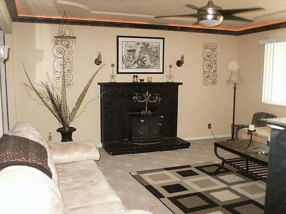 living room with lighting around drop ceiling