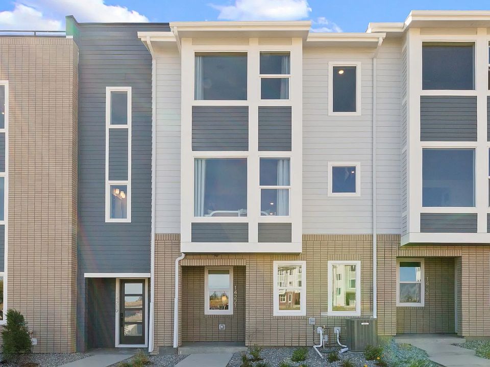Elegant modern design with expansive windows and refined brickwork in Dillon Pointe, offering sophis