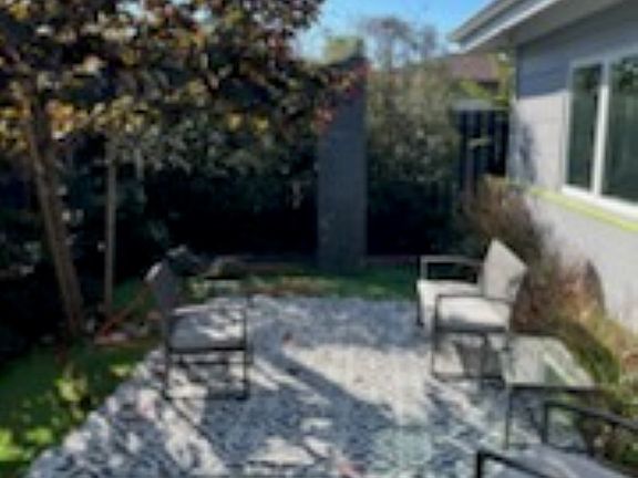 Private fenced courtyard with granite sculpture - patio furniture included