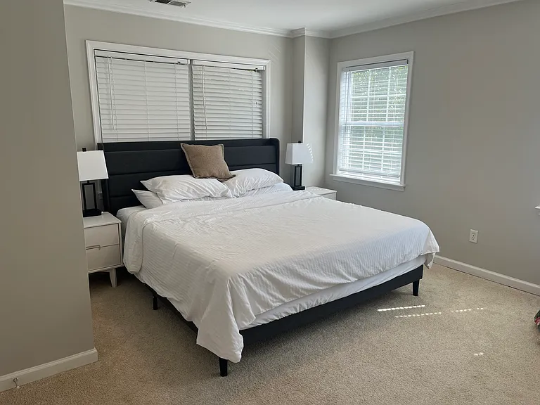 Master bedroom with king-size bed on the second floor