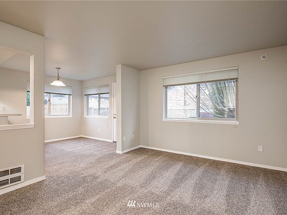 The home features vinyl windows and new carpeting