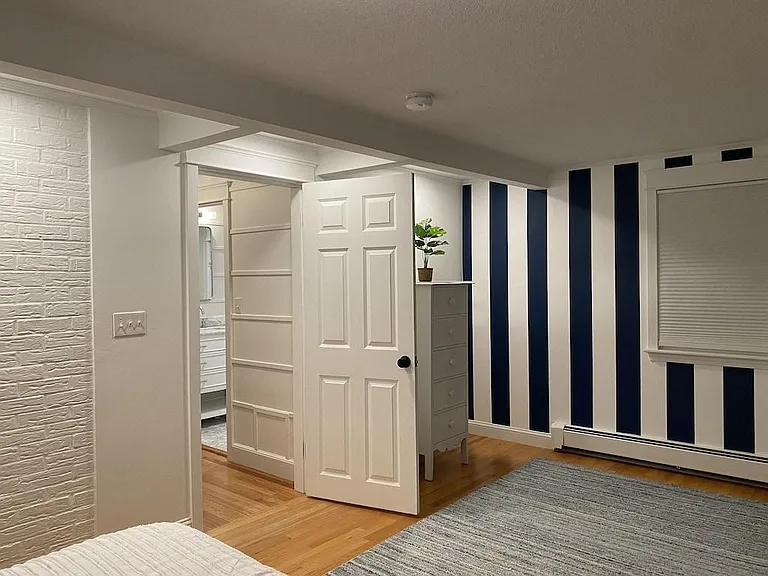 Upstairs twin bedroom ( blue white stripes)