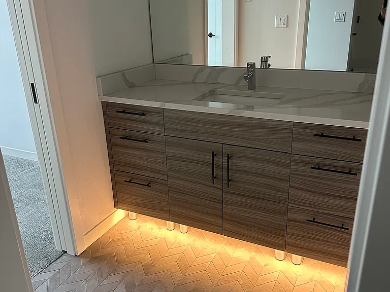 Motion sensitive under cabinet lighting in master bath. Programmable heated floor.