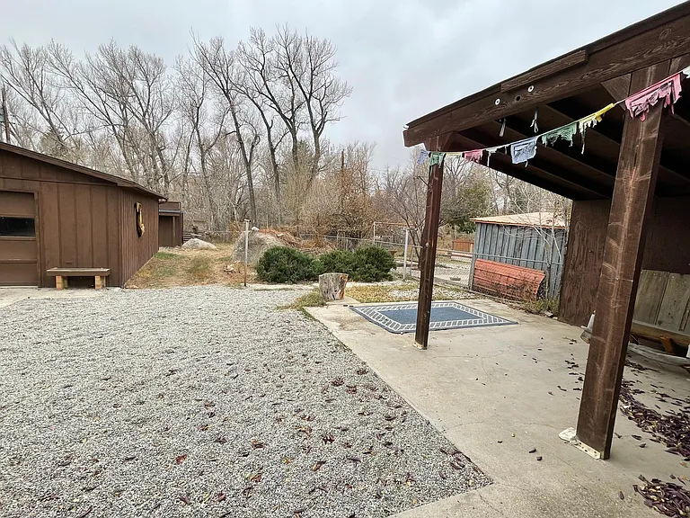 Backyard. There is a detached single car garage and a separate storage shed.