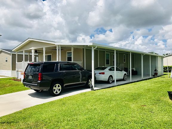 Carport fits 3 cars/shed