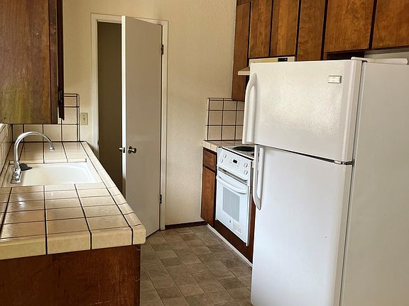 Kitchen showing walk in pantry.