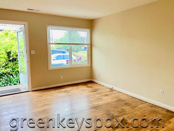 Front door opens into greenery