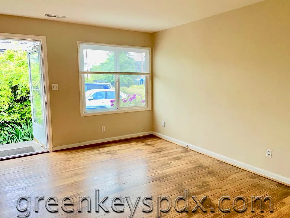 Front door opens into greenery