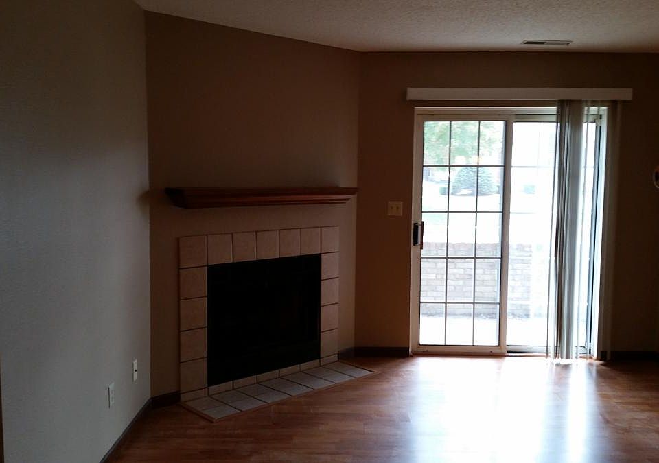 living room from kitchen toward private patio and fireplace