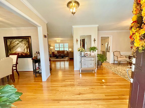 Elegant, front entryway with the formal dining on the left and formal living on the right.