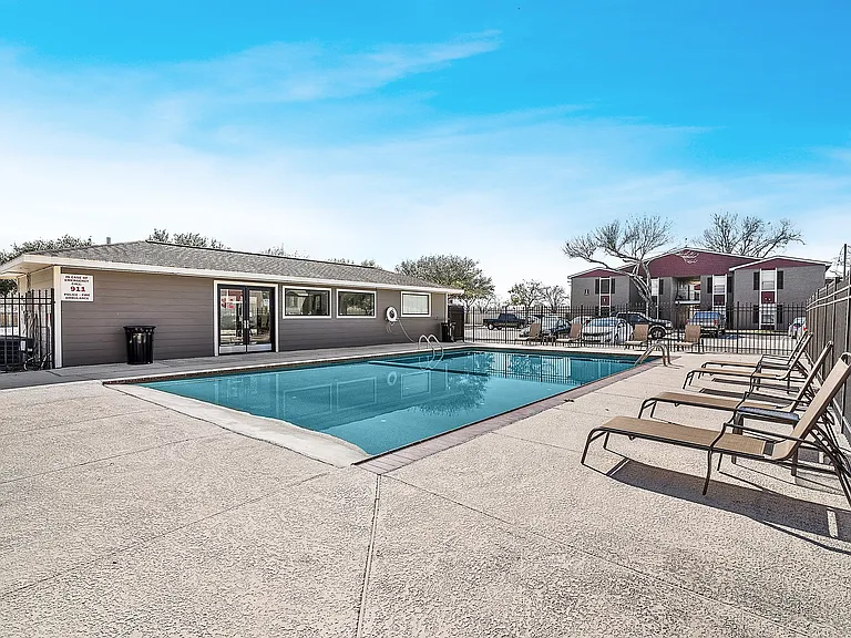 Relax under the Texas sun at our inviting pool area with spacious seating.