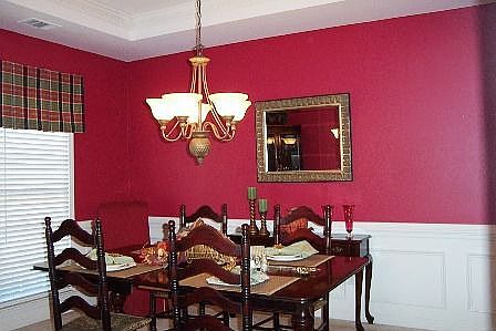 Formal dining room with trey ceiling, chair railing 