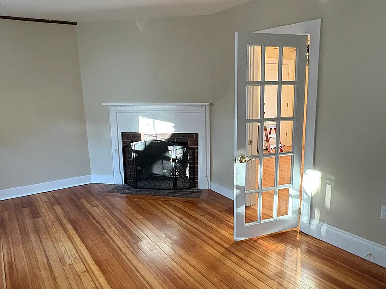 Living Room to Kitchen -Newly painted, Flooring redone. Fireplace #2