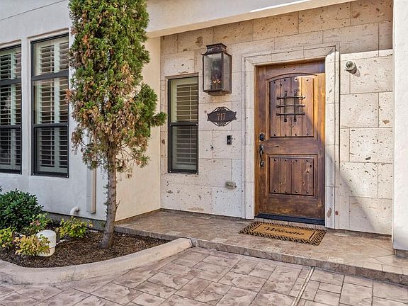 Gas lamp and mahogany wood door will welcome family and friends