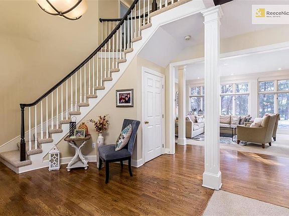 Warm & inviting entry with gleaming hardwoods