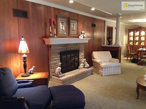 Fireplace in living room. See thru to hearth room.