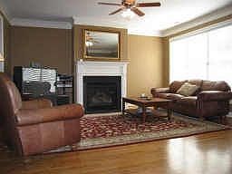 Spacious living room feels cozy with the fireplace