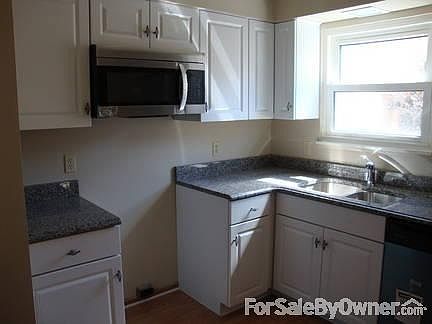 Kitchen BRAND NEW
						:
						new stainless steel microwave and dishwasher, sink, granite, and floor