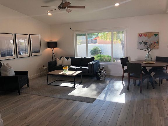 Living room and dining room furnished for context