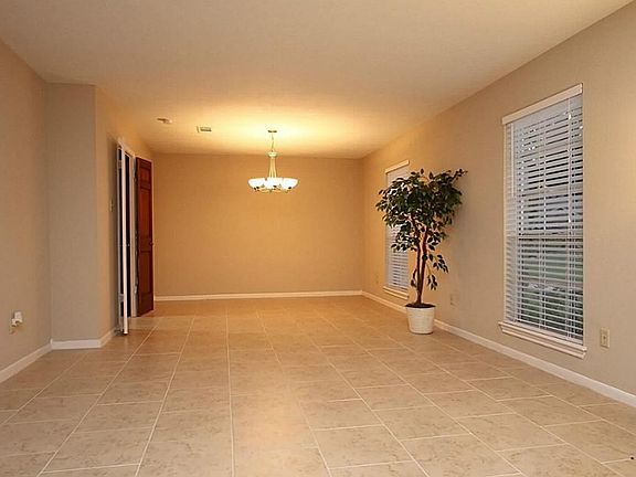 Notice the beautiful granite and travertine backsplash