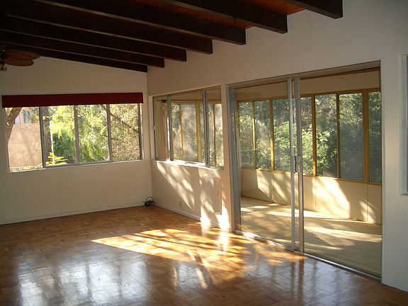 Living Room Area with Direct Access to Enclosed Porch Area